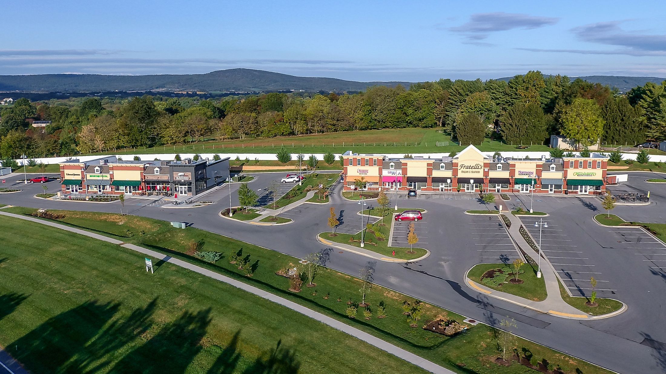 Aerial view of Cross Stone Commons, a two-building retail center in Middletown, Maryland, with the Catoctin ridgeline behind it